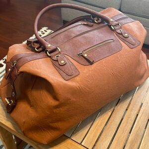 Tan leather duffle bag